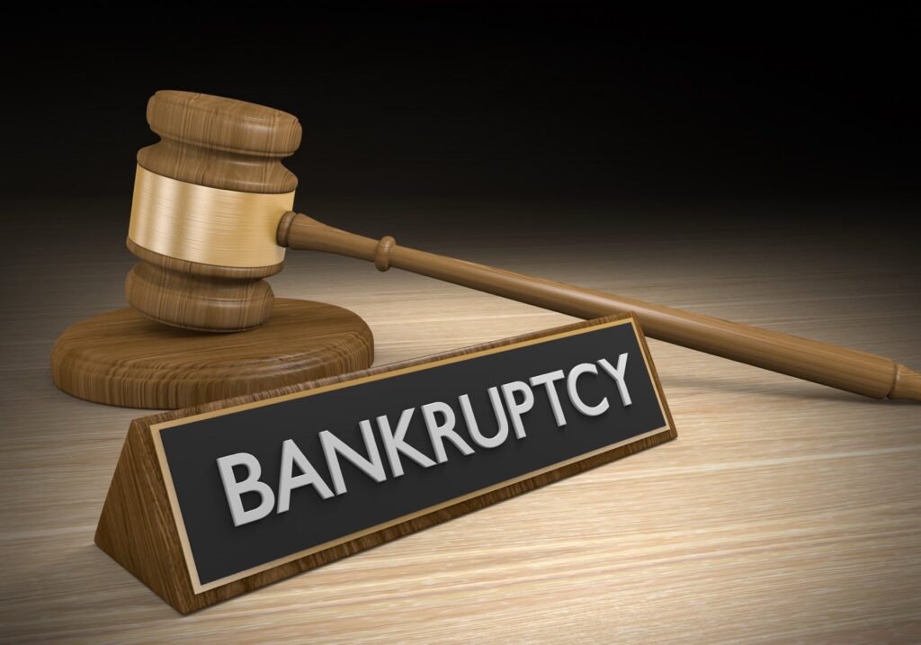 Bankruptcy sign next to a gavel